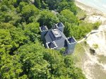 This dream home is nestled in the wooded dunes overlooking Lake Michigan